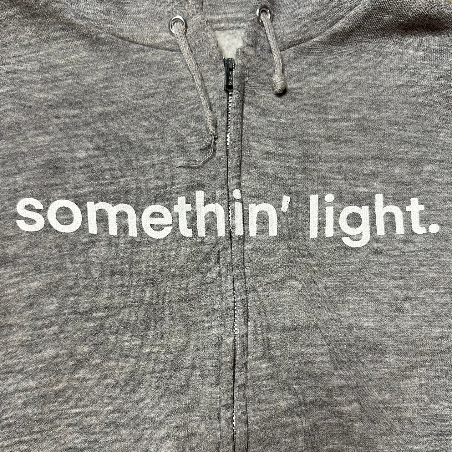 “somethin’ light” Zip Up Hoodie