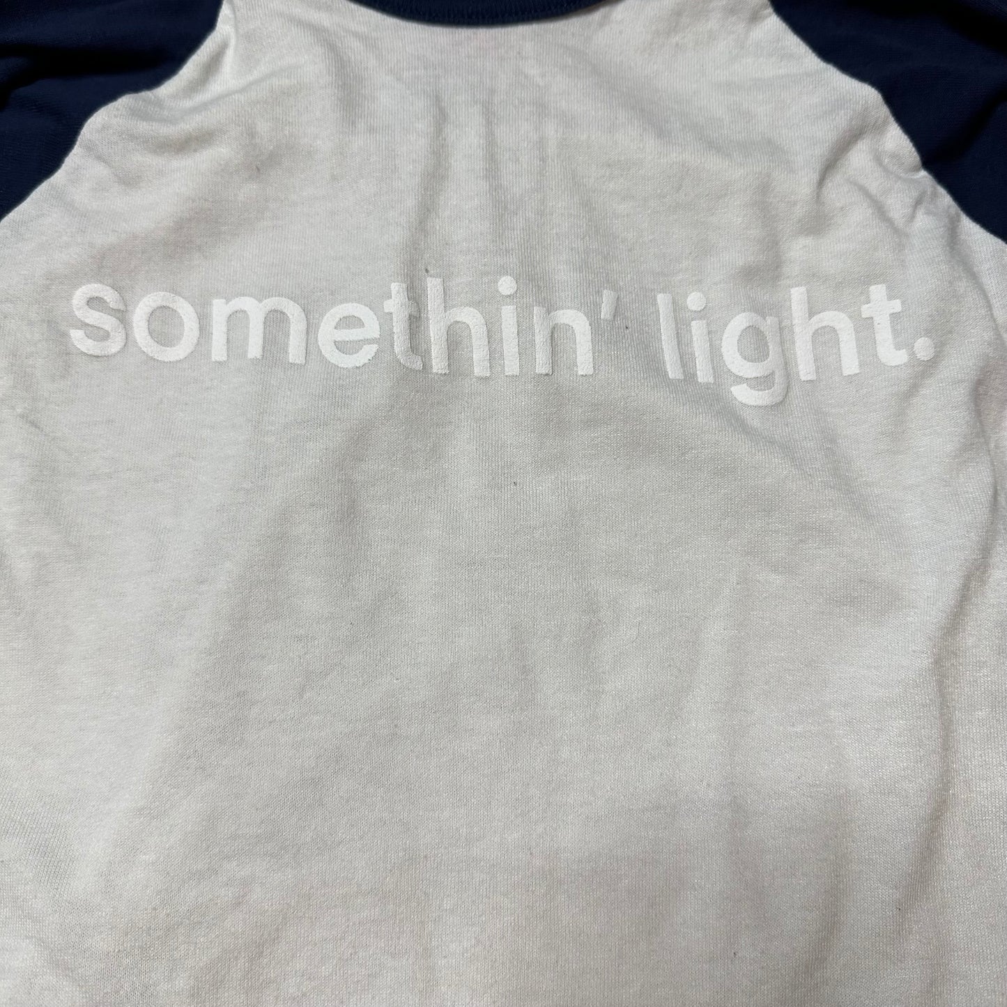 “somethin’ light” Baseball Tee