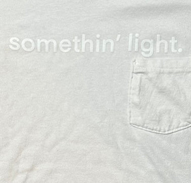 “somethin’ light” Box Cut Pocket Tee